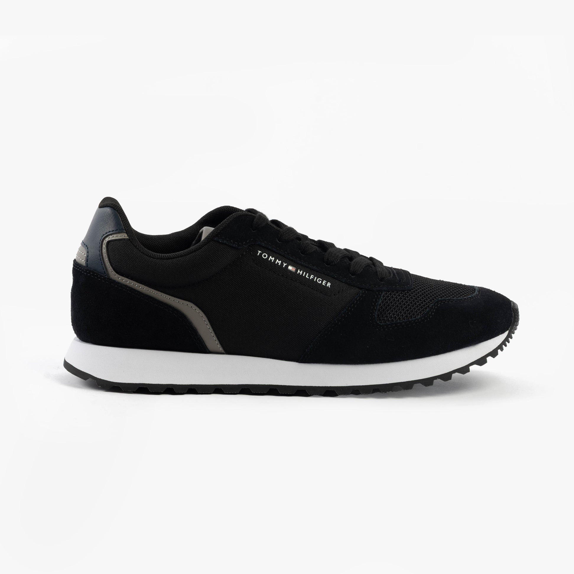 Tommy Hilfiger SUEDE LOGO Mens Trainers Black side view showing suede upper and rubber sole.