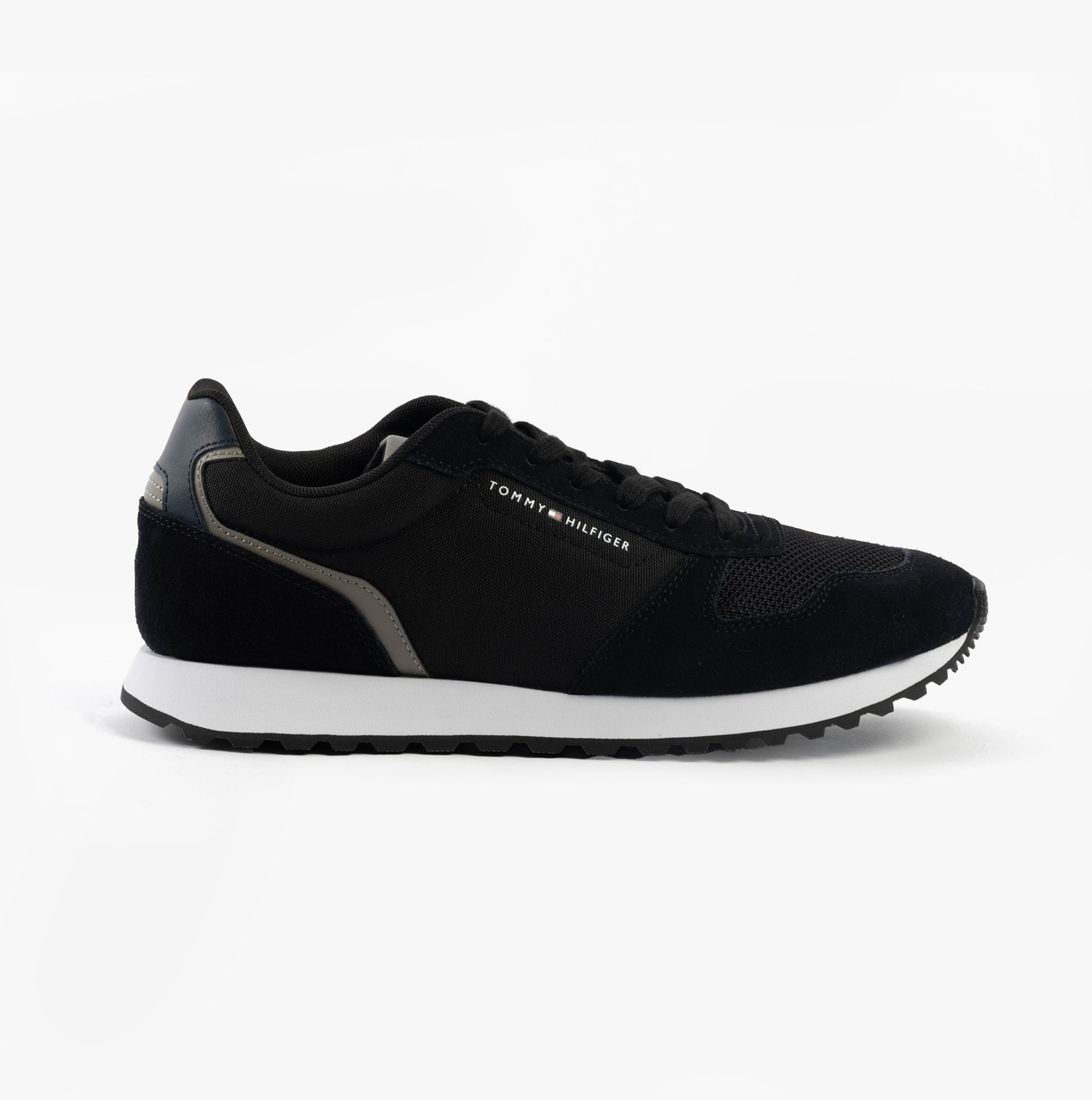 Tommy Hilfiger SUEDE LOGO Mens Trainers Black side view showing suede upper and rubber sole.