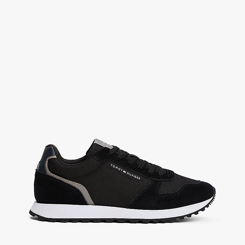 Tommy Hilfiger SUEDE LOGO Mens Trainers Black side view showing sleek design and lace-up closure.