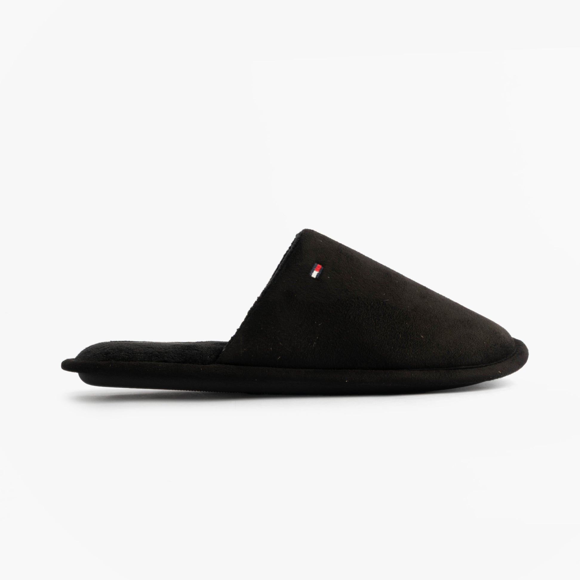 Tommy Hilfiger CORE HILFIGER FLAG H Mens Mule Slippers Black side view, comfortable slip-on footwear.