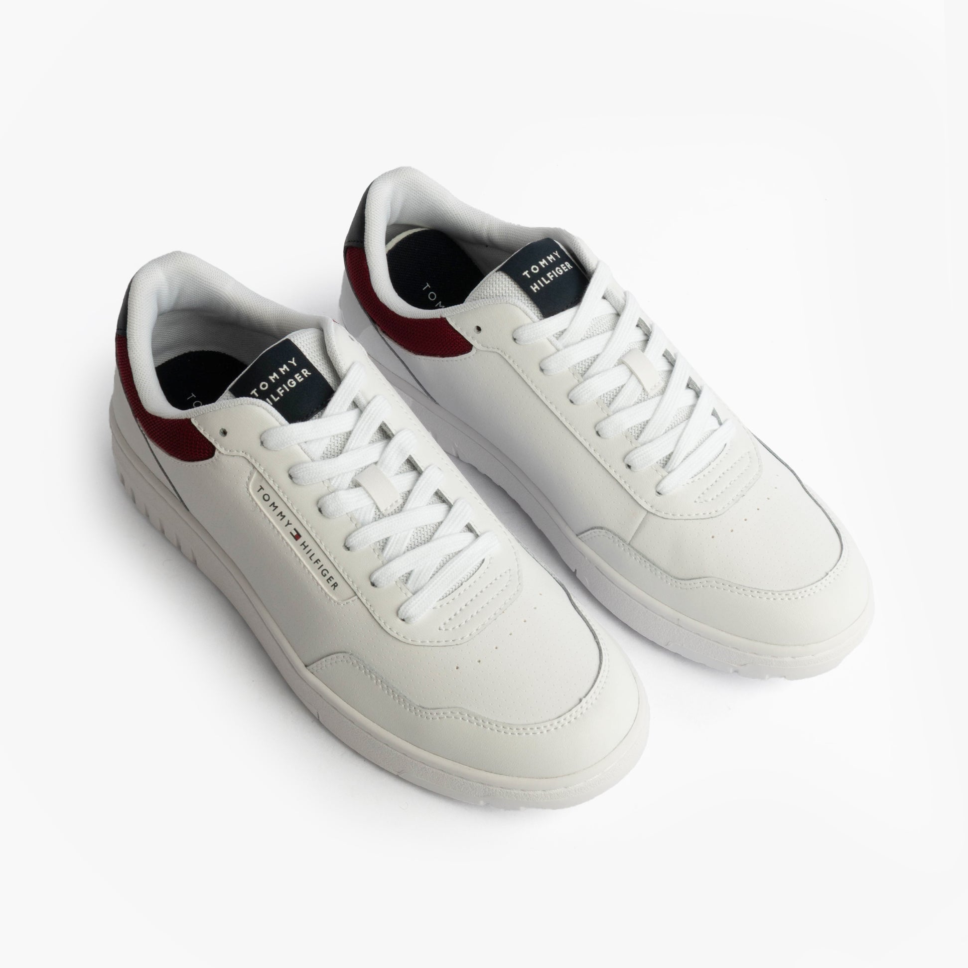 Tommy Hilfiger TH BASKET CORE LTH Mens Court Trainers Trainers Rwb top view showing white leather upper with red accents.
