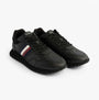 Tommy Hilfiger Mens Signature Tape Cleat Leather Trainers Black side view showing leather upper and lace-up closure