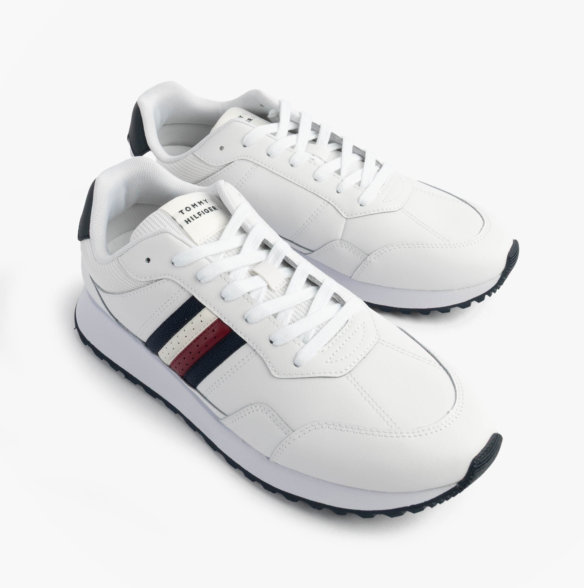 Tommy Hilfiger Mens Signature Tape Cleat Leather Trainers White front view with lace-up closure and rubber sole.