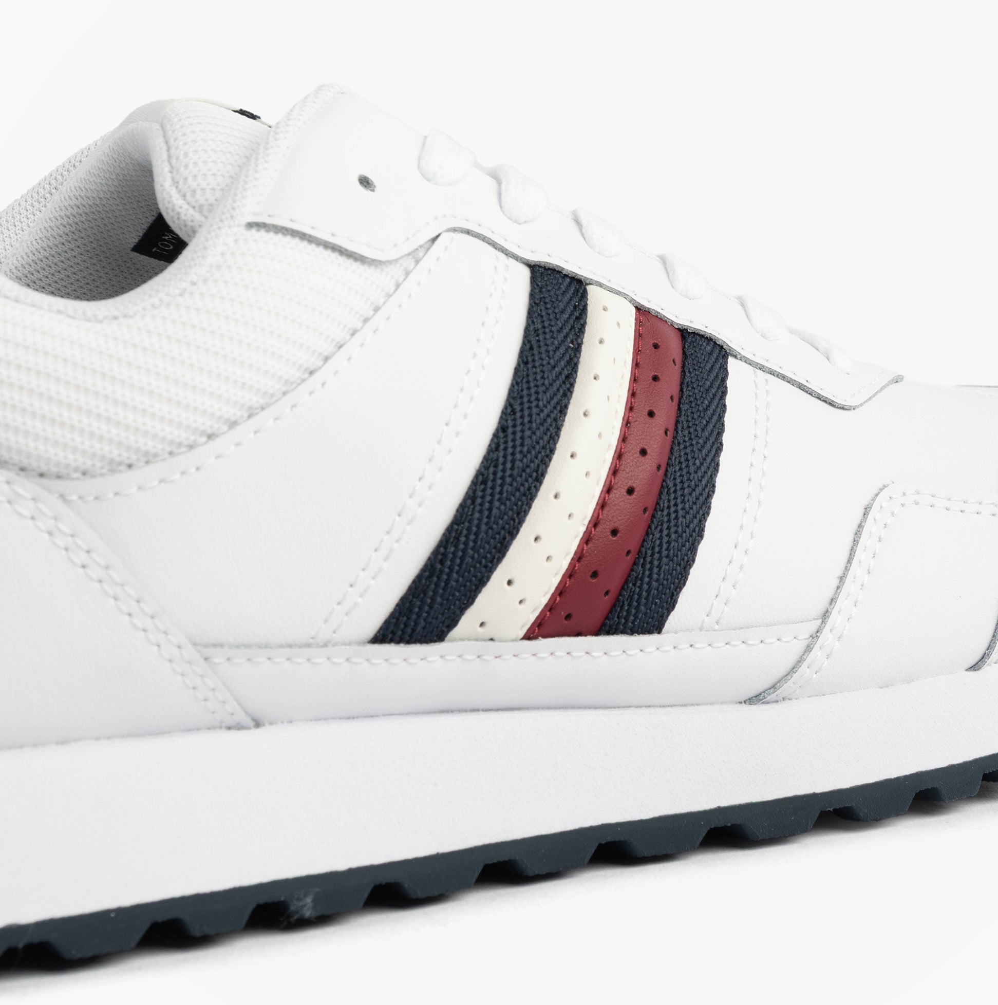 Tommy Hilfiger Mens Signature Tape Cleat Leather Trainers White side view showcasing the signature tape and leather details.