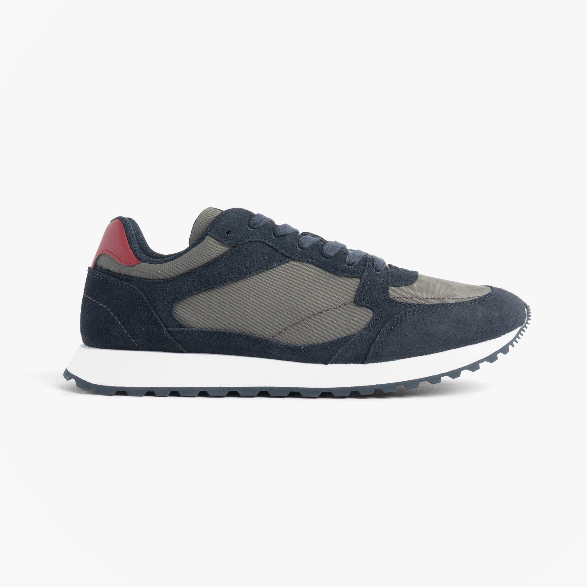 Tommy Hilfiger NEW RUNNER EVA MIX Mens Trainers Desert Sky side view showcasing navy leather and suede materials.