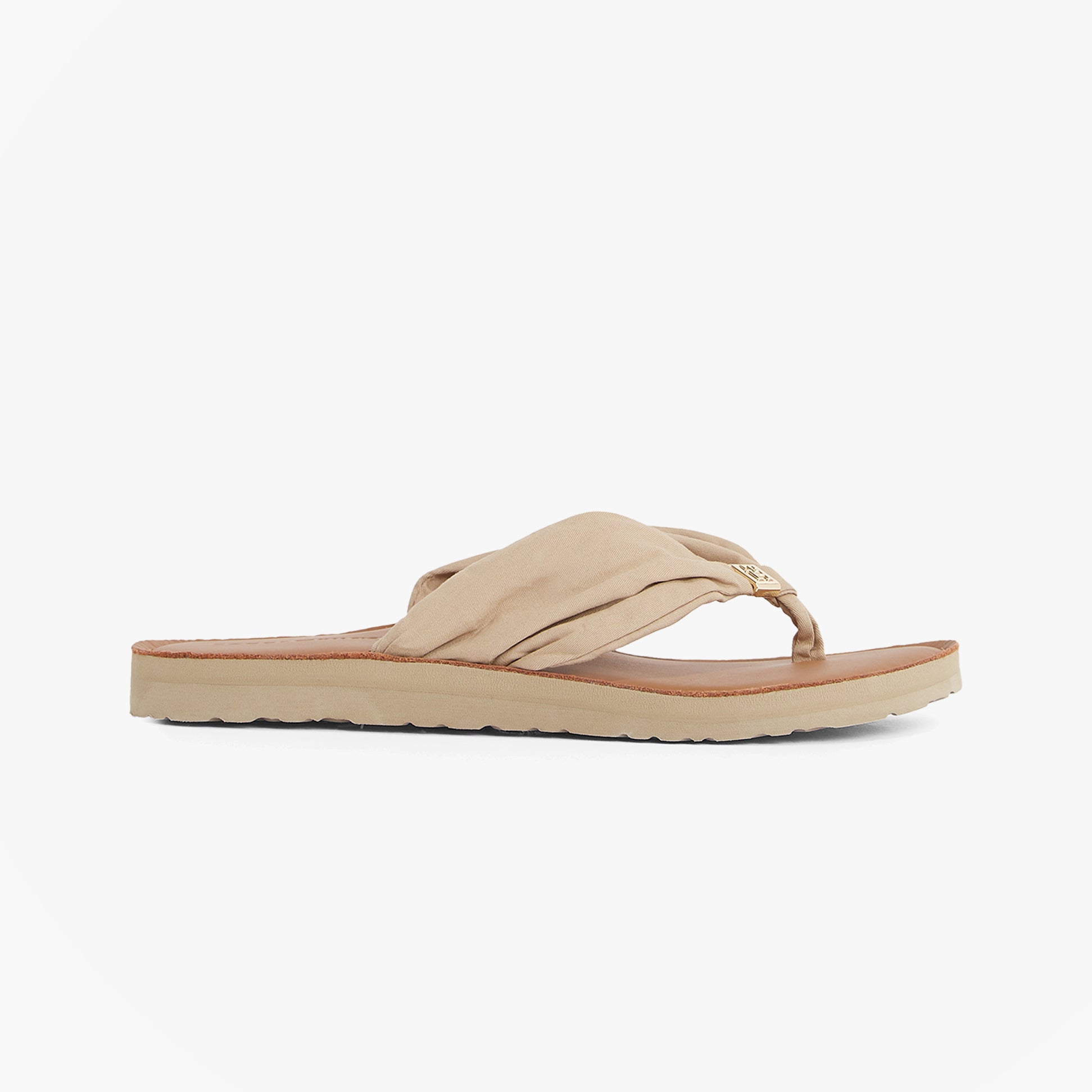 Tommy Hilfiger Monogram Plaque Womens Flip-Flop Beige side view showcasing slip-on design and lightweight materials.