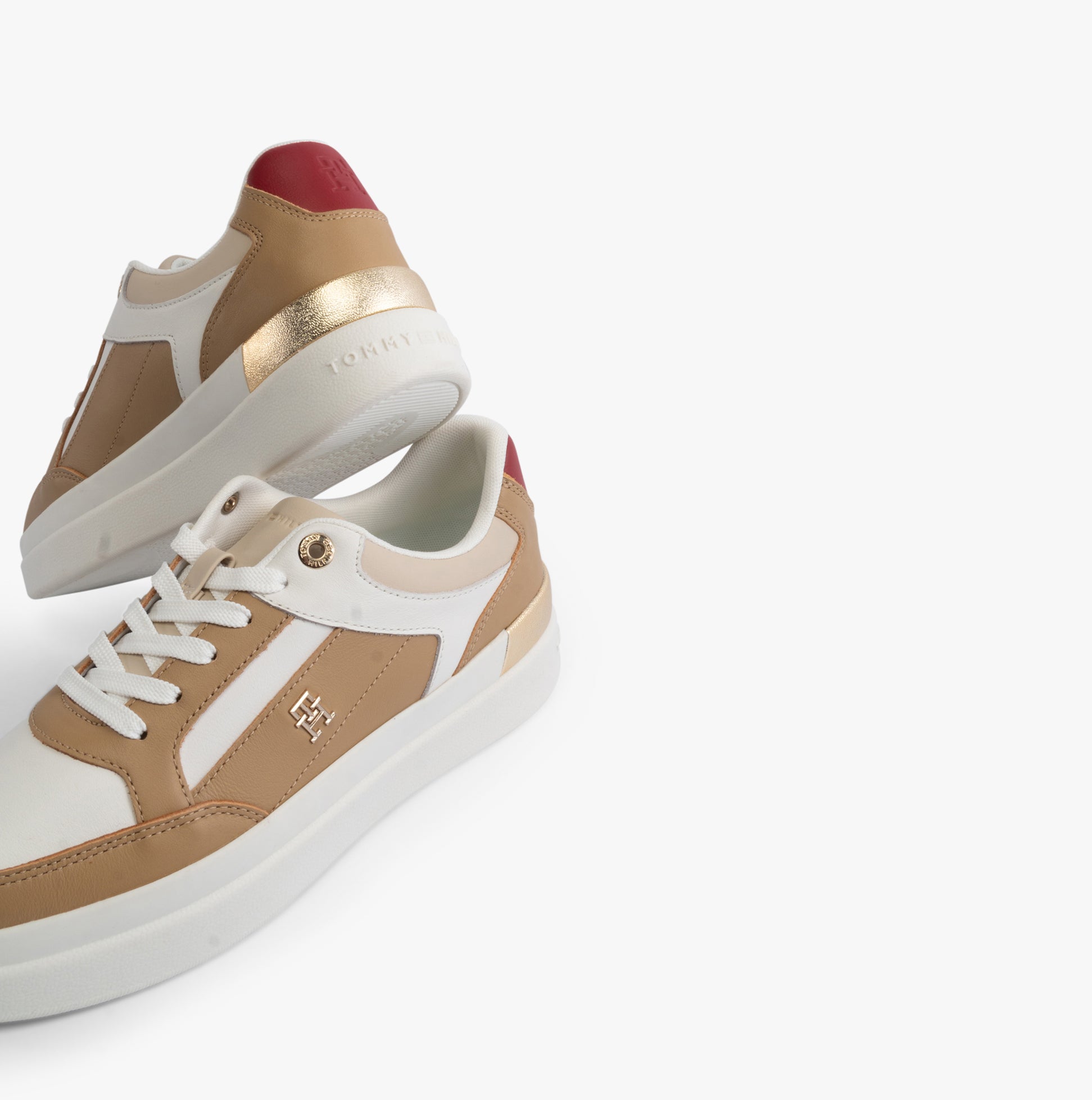 Tommy Hilfiger MONOGRAM METALLIC LEATHER Womens Court Trainers Classic Khaki side view with gold accents and red heel.