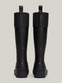 Tommy Hilfiger RUBBER Womens Long Boots Black rear view, showcasing knee-high rubber design with textured upper.
