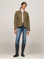 Tommy Hilfiger RUBBER Womens Long Boots Black worn with a quilted jacket and denim jeans, front view.