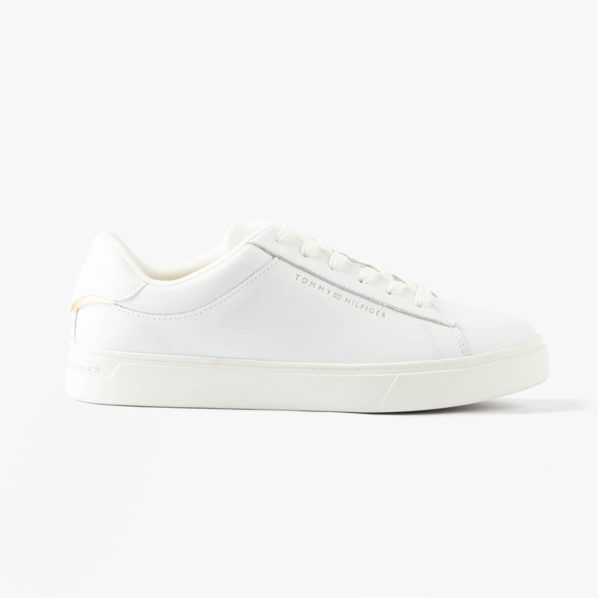 Tommy Hilfiger ESSENTIAL COURT Womens Trainers White side view showcasing casual leather design and lace-up closure.