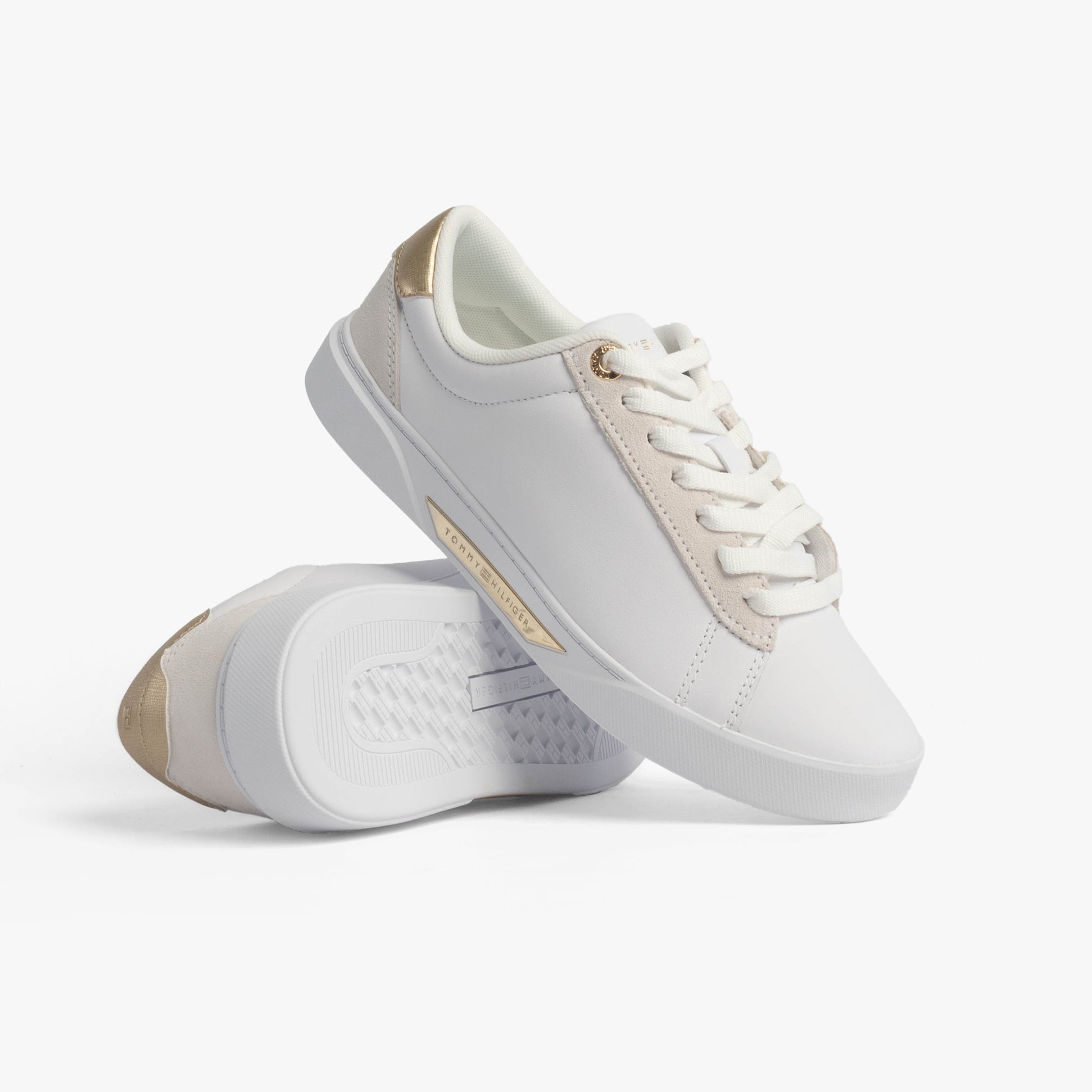 Tommy Hilfiger CHIC COURT Womens Trainers White, side view with gold accents and lace-up closure.