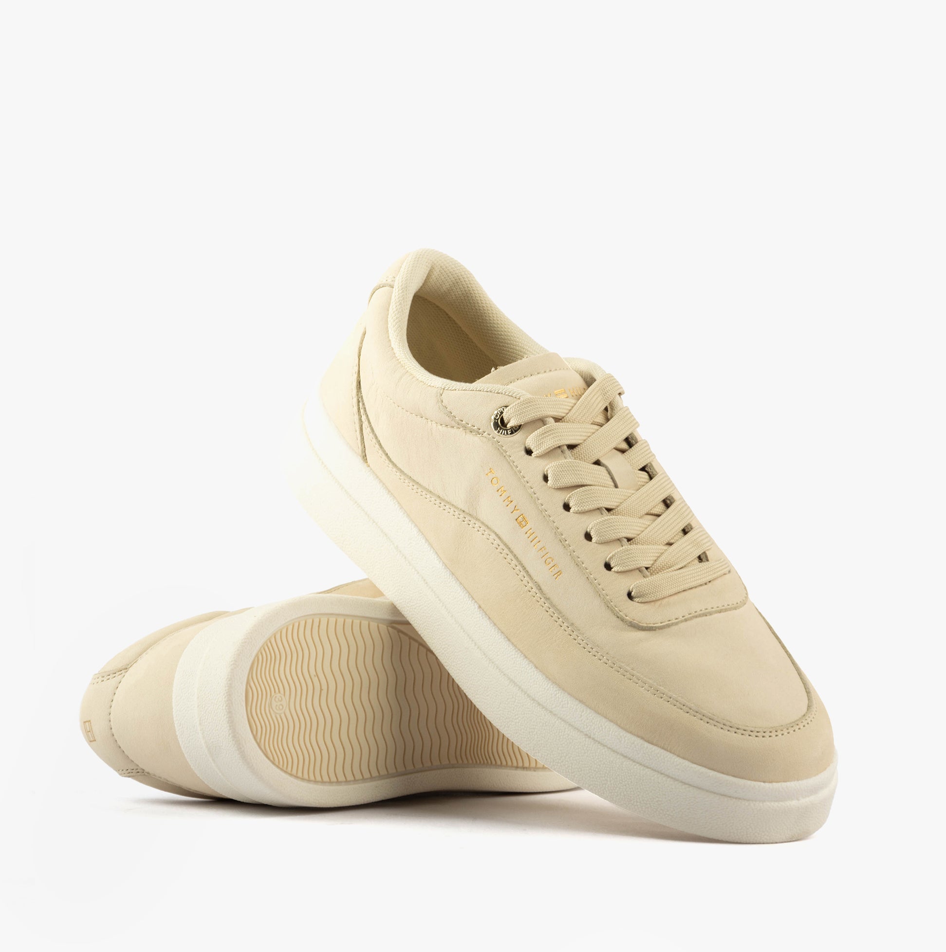 Tommy Hilfiger MODERN COURT SNEAKER Womens Muslin side view with light beige leather upper and lace-up closure.