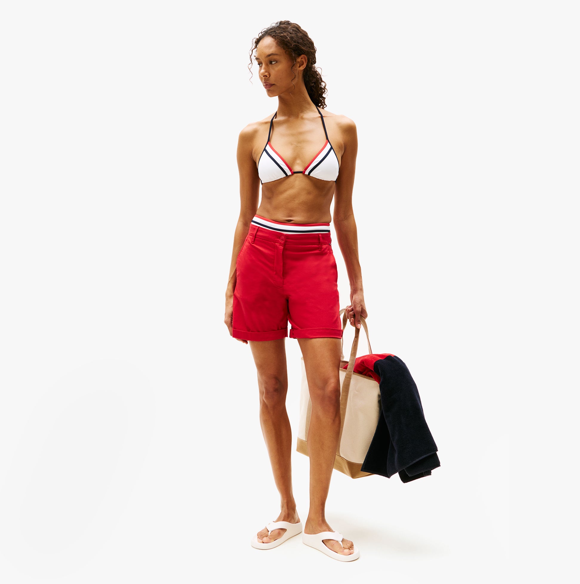 Tommy Hilfiger ENAMEL FLAG CONTOURED Womens Sandals Ancient White worn with red shorts and bikini in a side view.