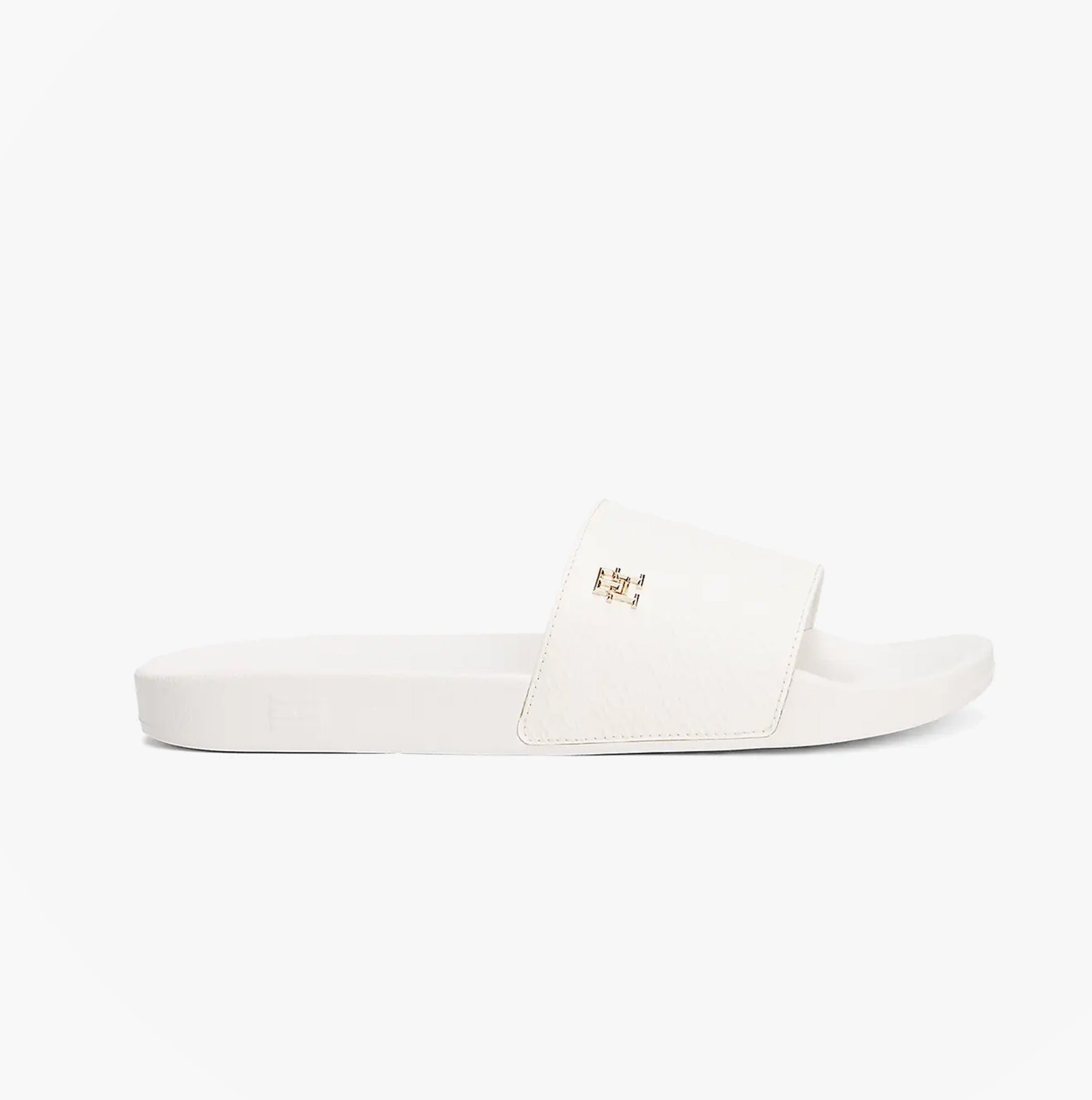 Tommy Hilfiger MONOGRAM POOLSIDE Womens Sliders White side view, featuring embossed TH monogram on strap.