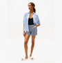 Tommy Hilfiger MONOGRAM POOLSIDE Womens Sliders White side view with model wearing casual summer outfit.