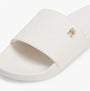 Tommy Hilfiger MONOGRAM POOLSIDE Womens Sliders White side view showing embossed TH monogram and plaque details.