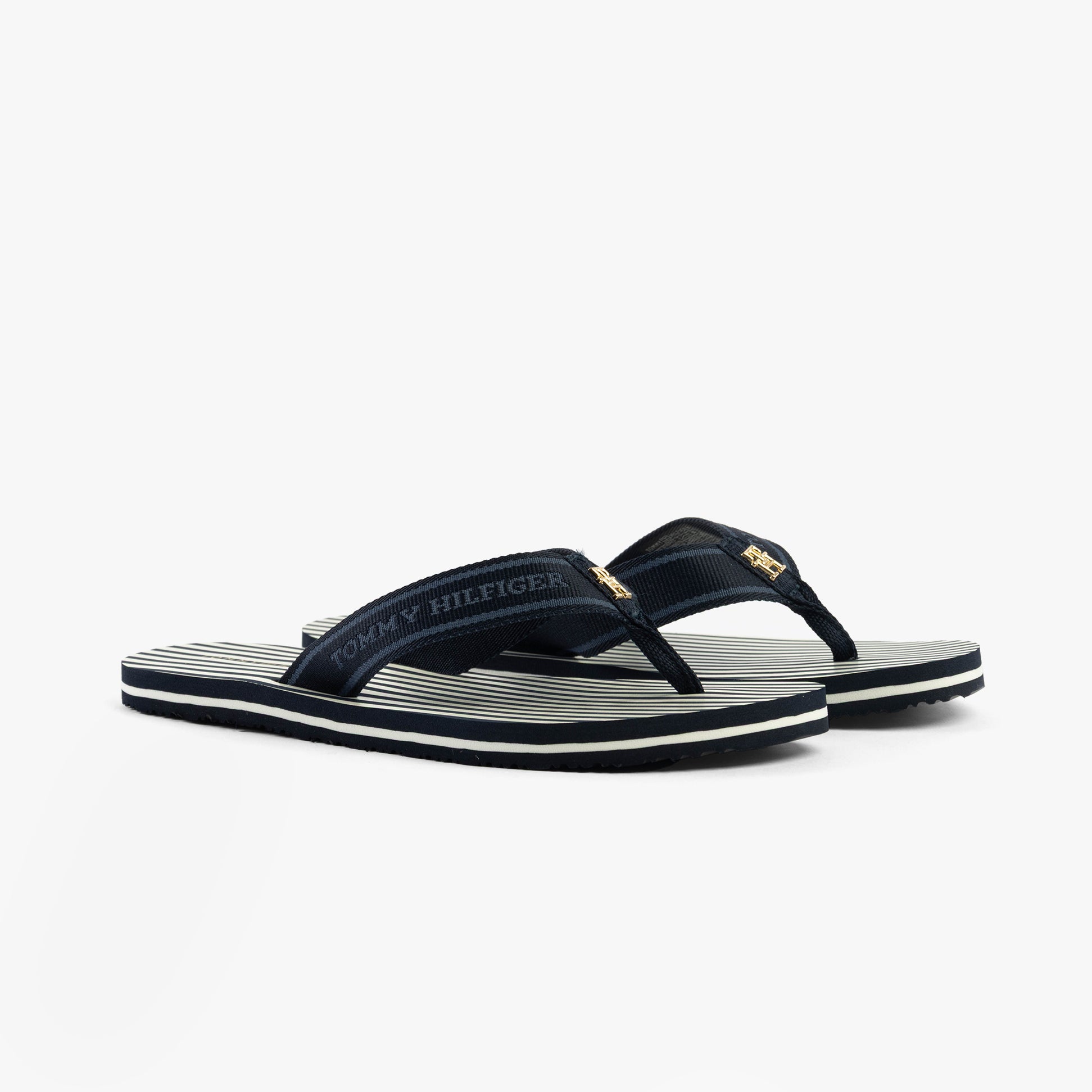 Tommy Hilfiger STRIPES LOGO Womens Flip-Flops Space Blue side view showcasing sleek design and strappy detail.