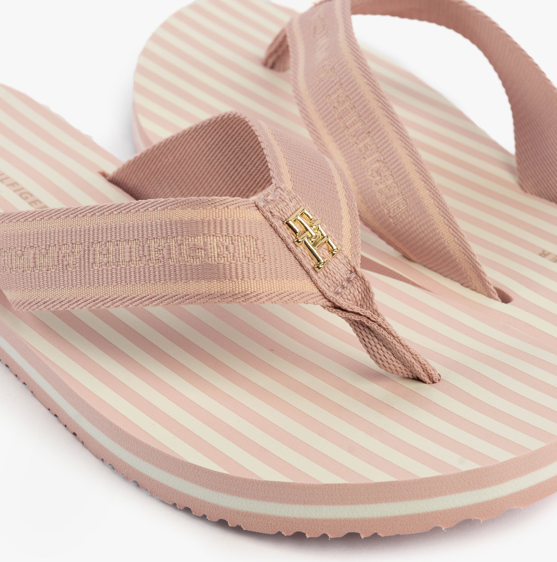 Tommy Hilfiger STRIPES LOGO Womens Flip-Flops Foggy Pink, side view highlighting the striped design and logo detail.