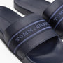 Tommy Hilfiger POOLSIDE Logo Webbing Sliders Navy detail view showing logo webbing strap and lightweight design.