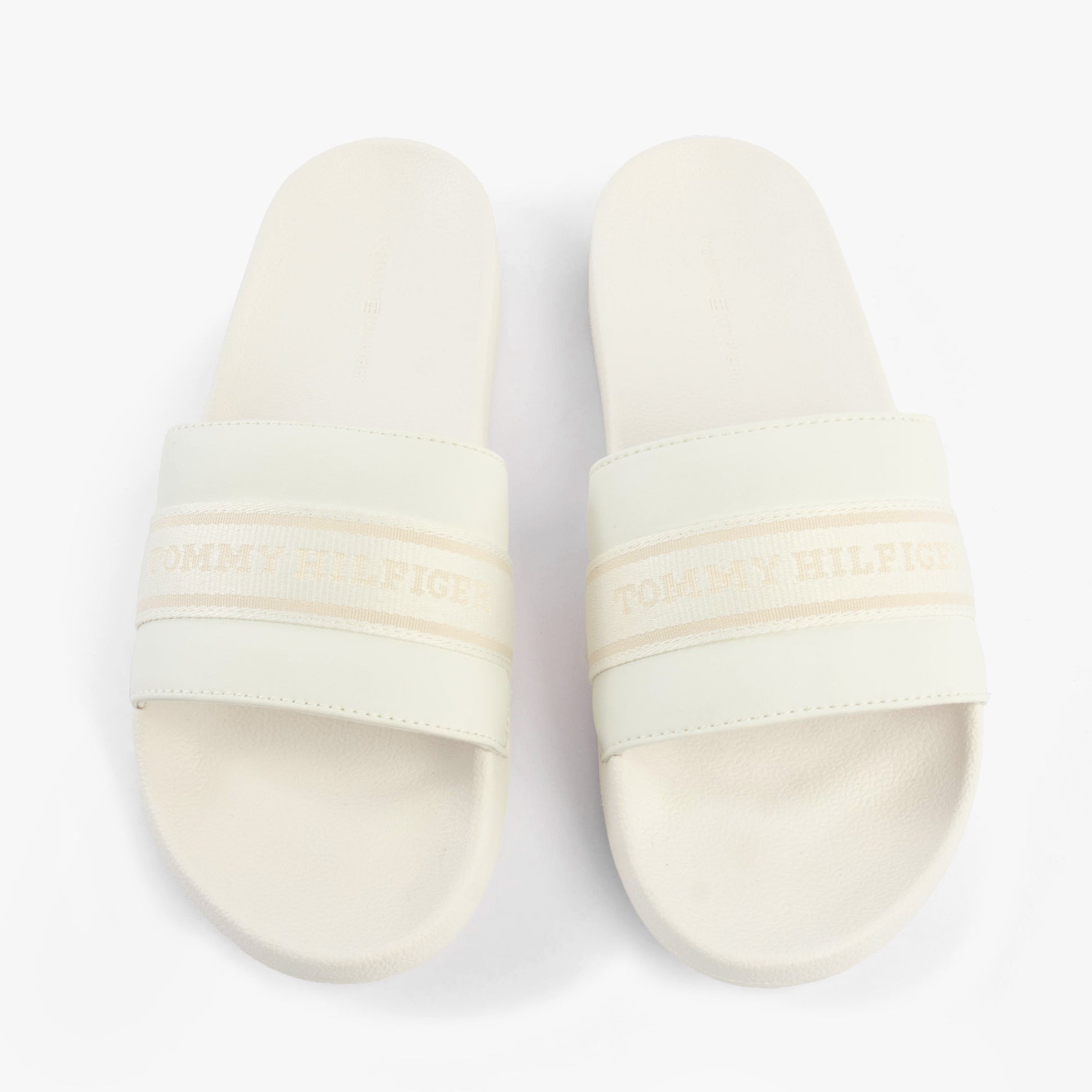 Tommy Hilfiger LOGO WEBBING Womens Slides Ecru top view showcasing the slip-on design and logo detailing.