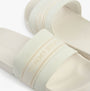Tommy Hilfiger LOGO WEBBING Womens Slides Ecru top view showcasing the logo and comfortable slip-on design.