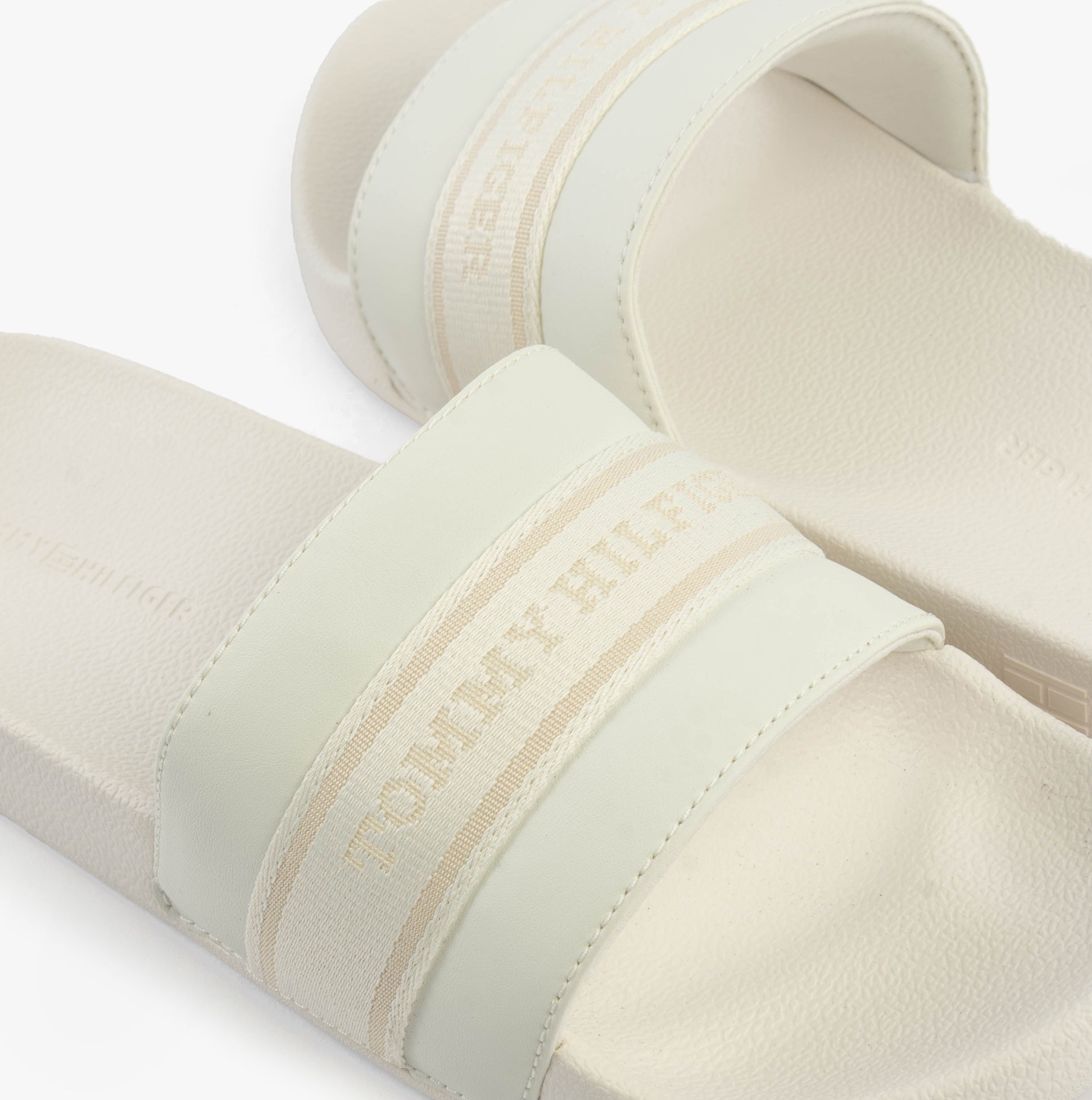 Tommy Hilfiger LOGO WEBBING Womens Slides Ecru top view showcasing the logo and comfortable slip-on design.