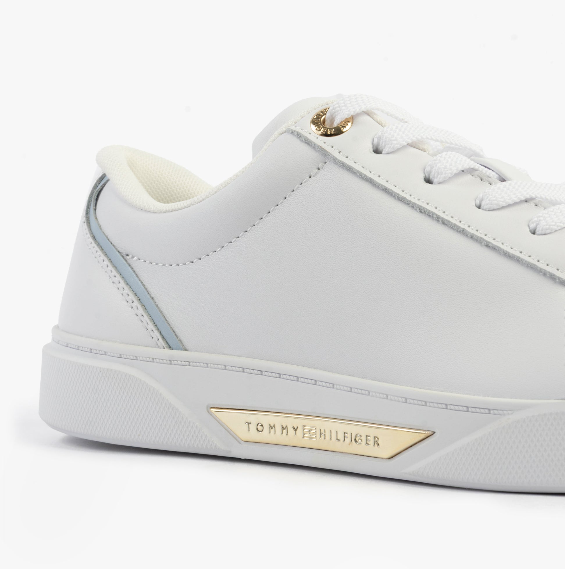Tommy Hilfiger CHIC COURT SNEAKER Womens Trainers White side view showing leather upper and gold logo detail.