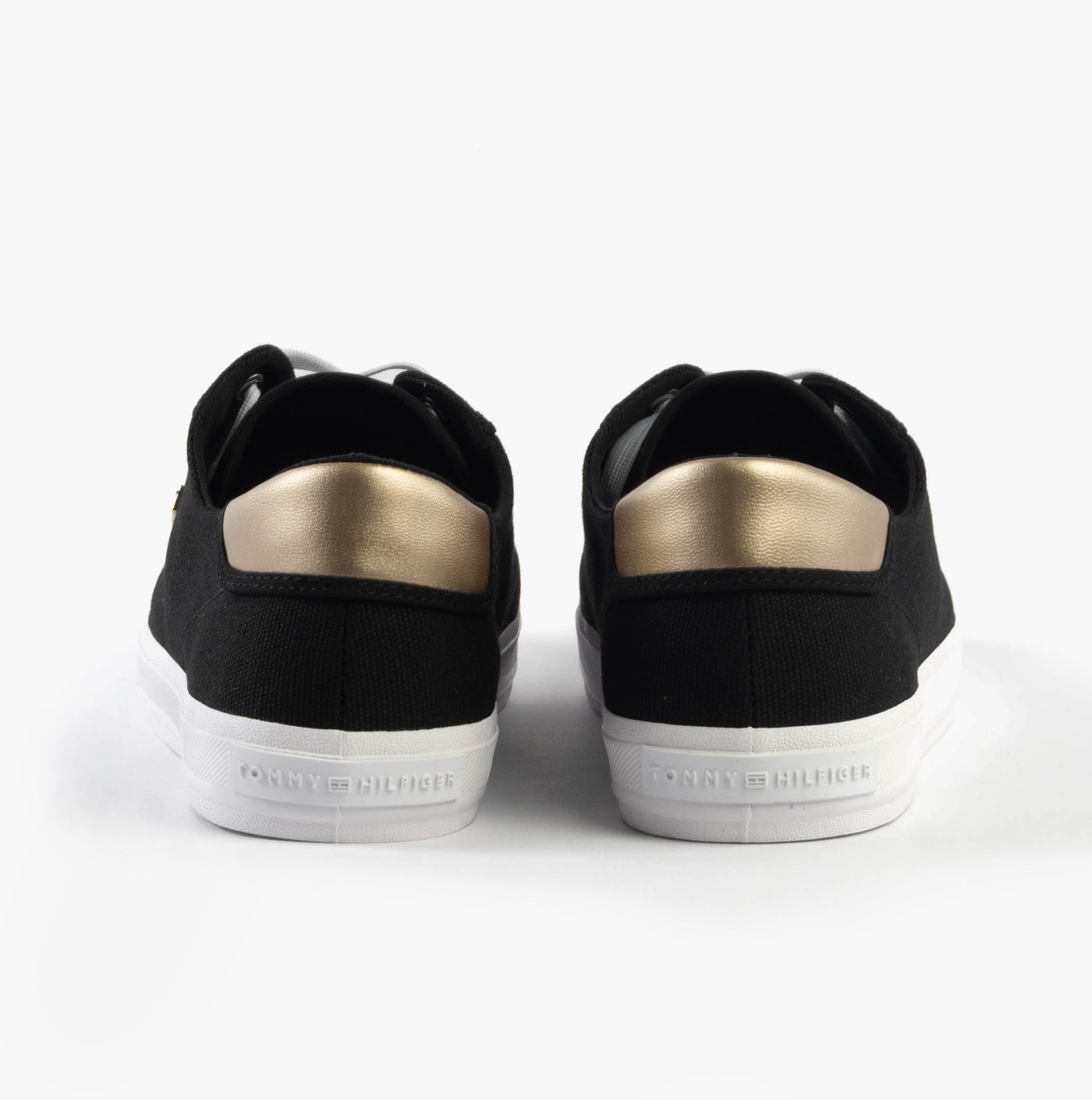 Tommy Hilfiger CANVAS METALLIC HEEL Womens Trainers Black back view featuring black canvas and metallic heel detail.