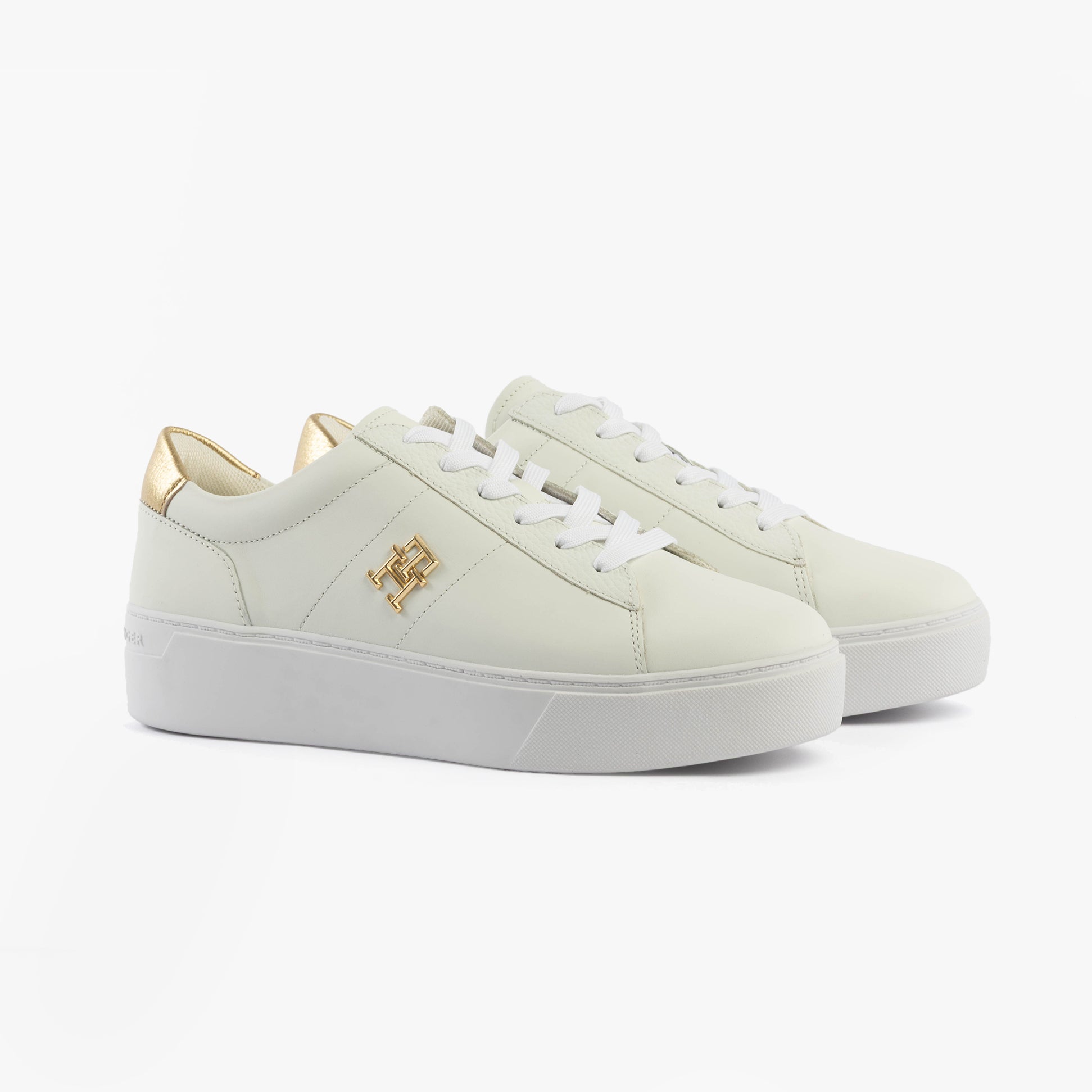 Tommy Hilfiger PLATFORM COURT Womens Trainers White side view with gold accents and white laces on a light background.