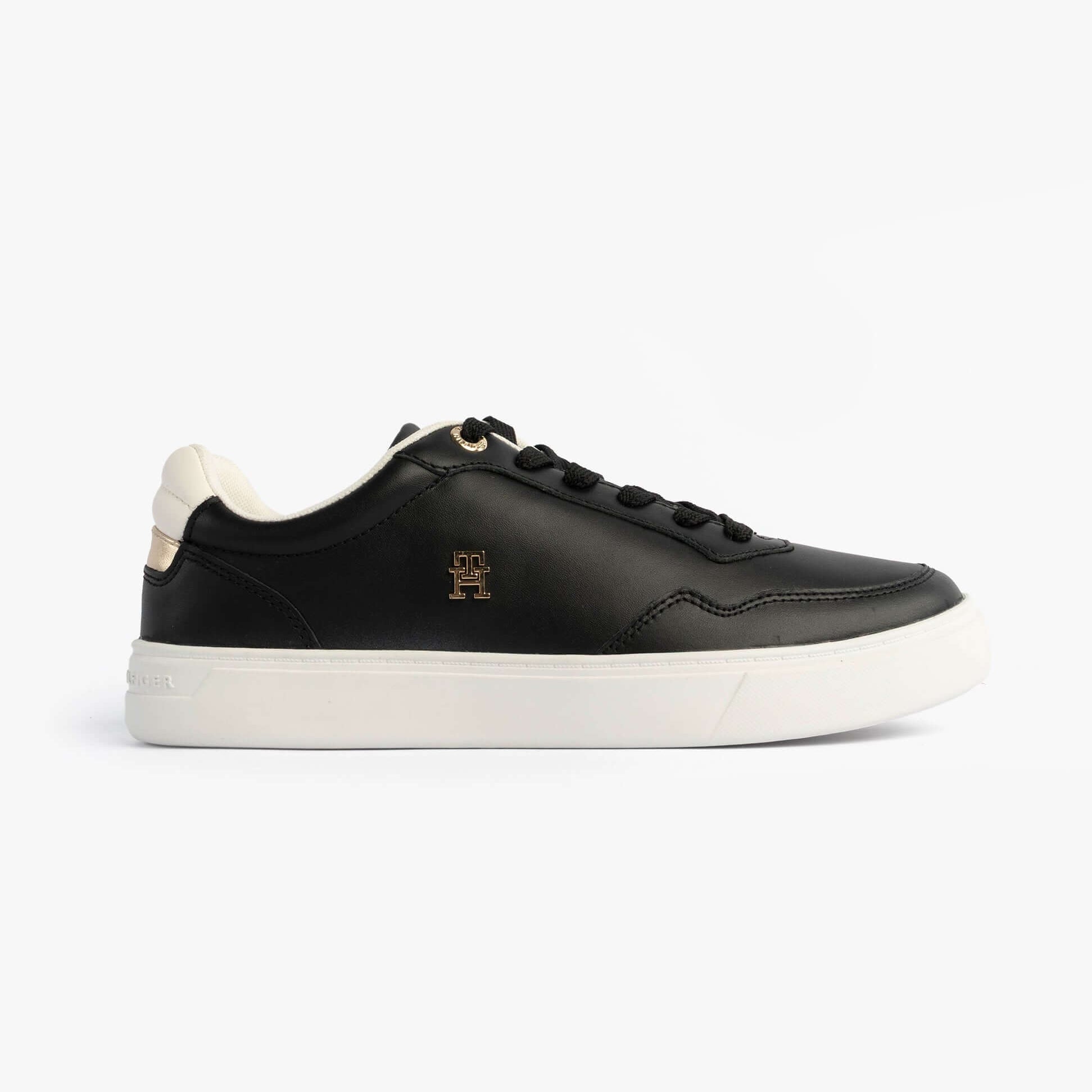Tommy Hilfiger Womens Leather TH Monogram Plaque Court Trainers Black side view with lace-up closure and round toe.