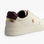 Tommy Hilfiger ELEVATED COURT SNEAK Womens Court Trainers Trainers Ancient White side view with gold accents.