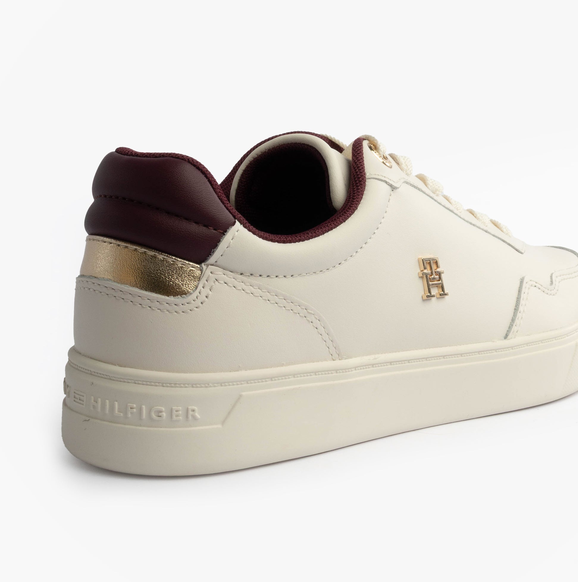 Tommy Hilfiger ELEVATED COURT SNEAK Womens Court Trainers Trainers Ancient White side view with gold accents.