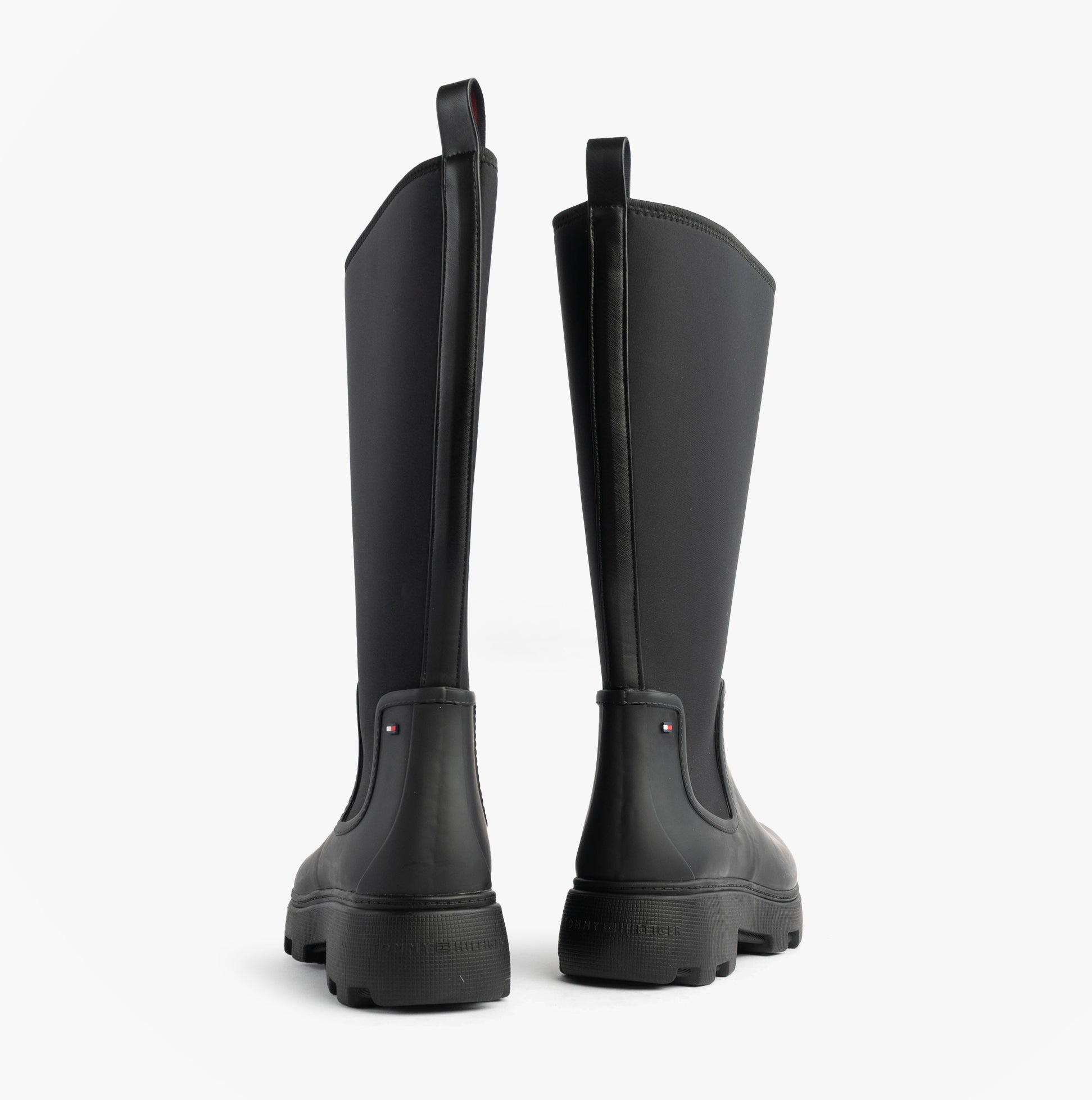 Tommy Hilfiger FLAG LONG RAINBOOT Womens Boots Black back view showing rubber upper and elasticated side panel.