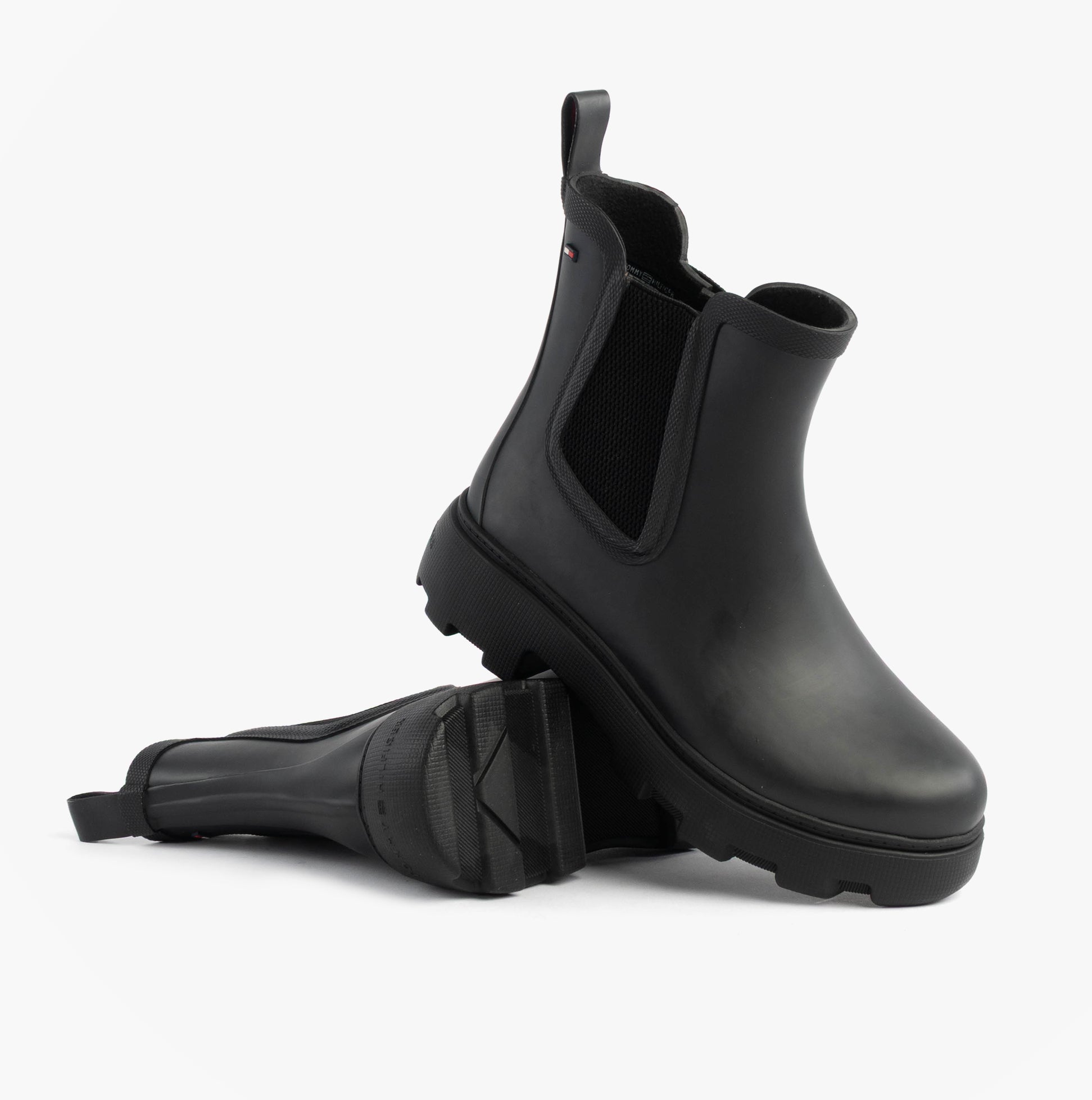 Tommy Hilfiger ANKLE RAINBOOT Womens Boots Black side view showcasing the durable rubber material and elasticated side panels.