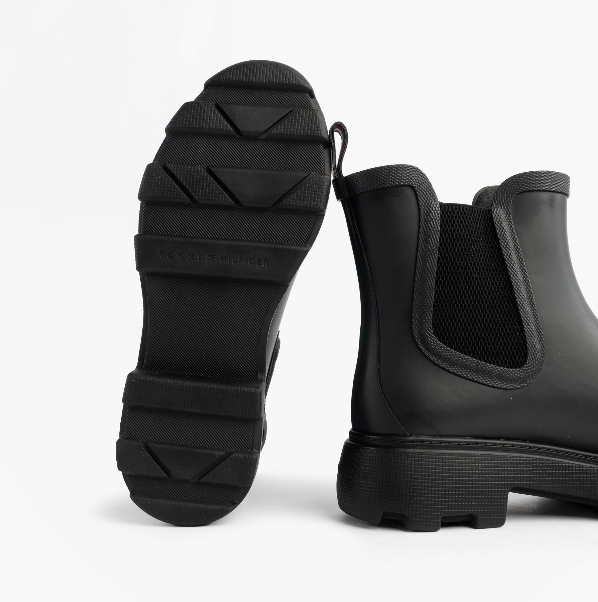 Tommy Hilfiger ANKLE RAINBOOT Womens Boots Black rear view showcasing rubber sole and elasticated side panel.
