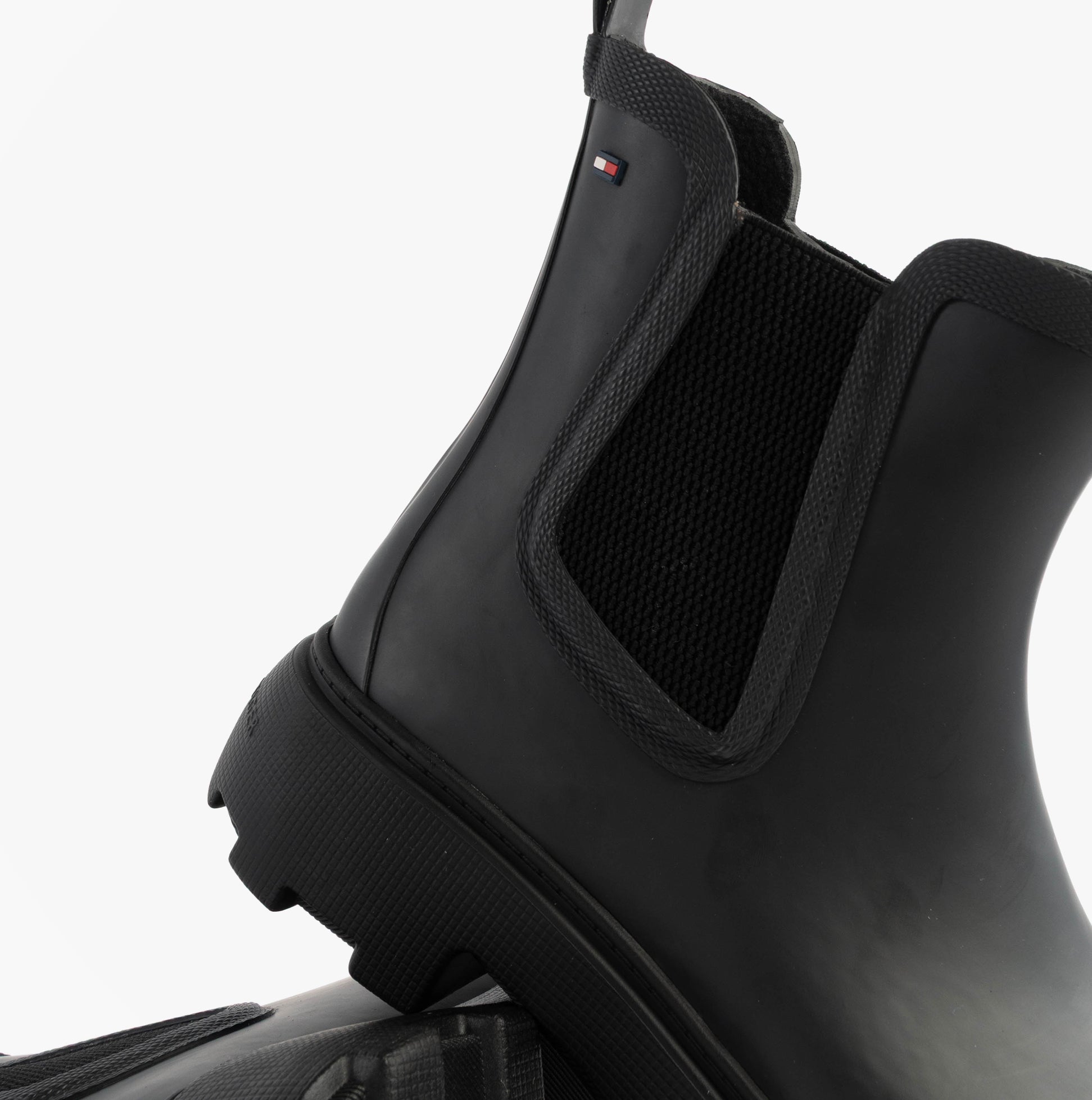 Tommy Hilfiger ANKLE RAINBOOT Womens Boots Black side view showing elasticated side panel and rubber sole.