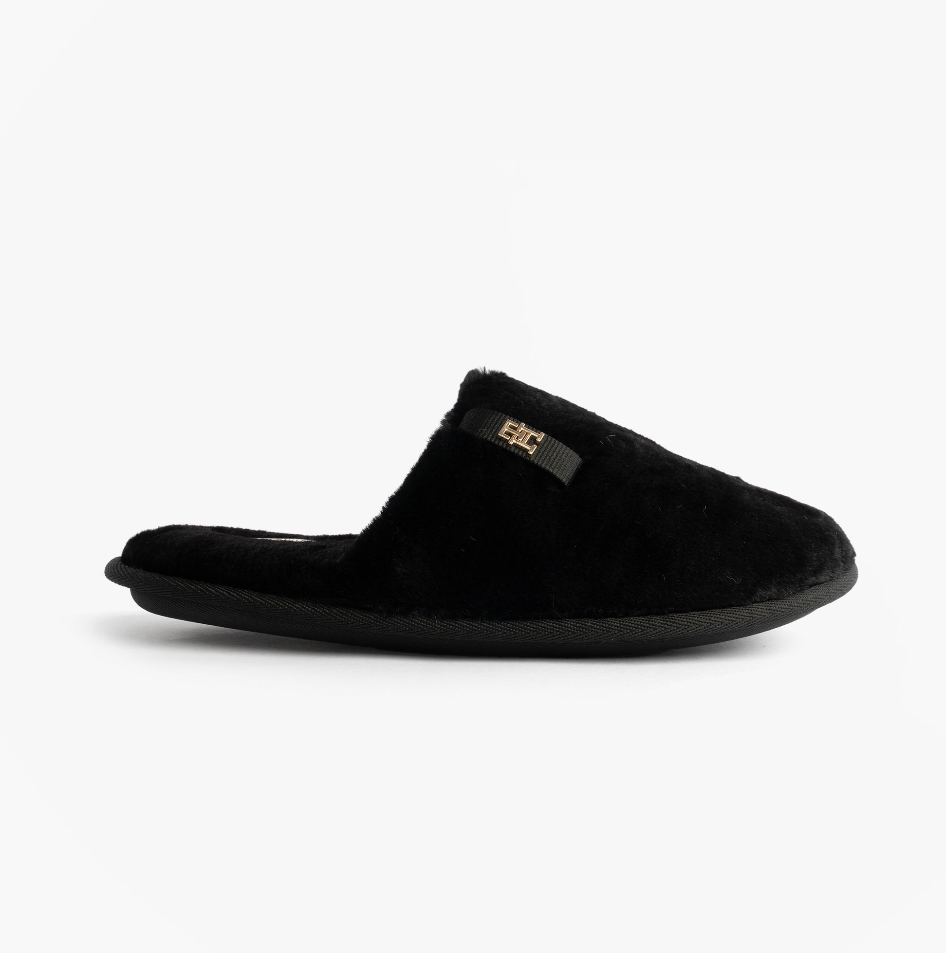 Tommy Hilfiger TH FAUX FUR HOUSE SH Womens Slippers Black side view showcasing soft faux fur design.