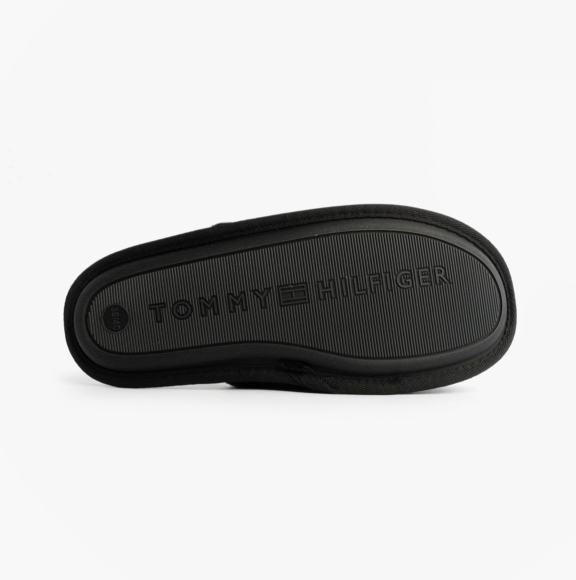 Tommy Hilfiger TH FAUX FUR HOUSE SH Womens Slippers Black bottom view showing the sole with logo.