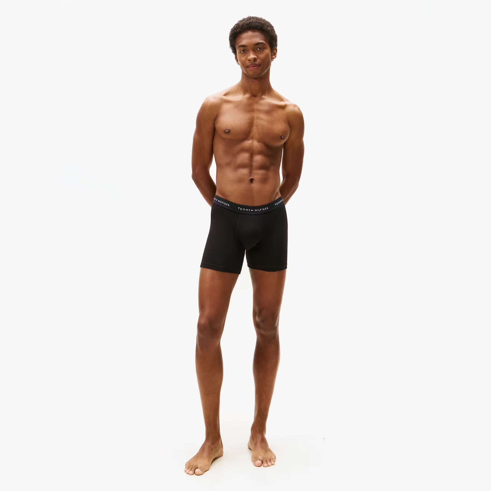 Tommy Hilfiger 3 Pack Mens BOXER BRIEF Black worn by model, front view, showcasing comfortable fit and stylish design.