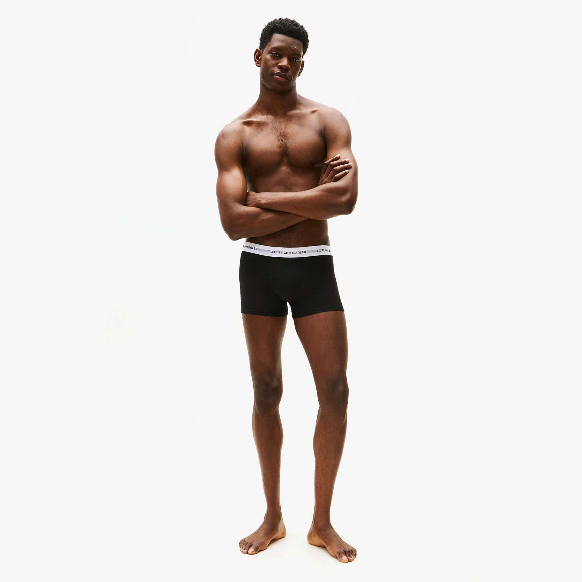 Tommy Hilfiger Mens 3 Pack Trunks Black front view worn by a model, showcasing comfort and style.