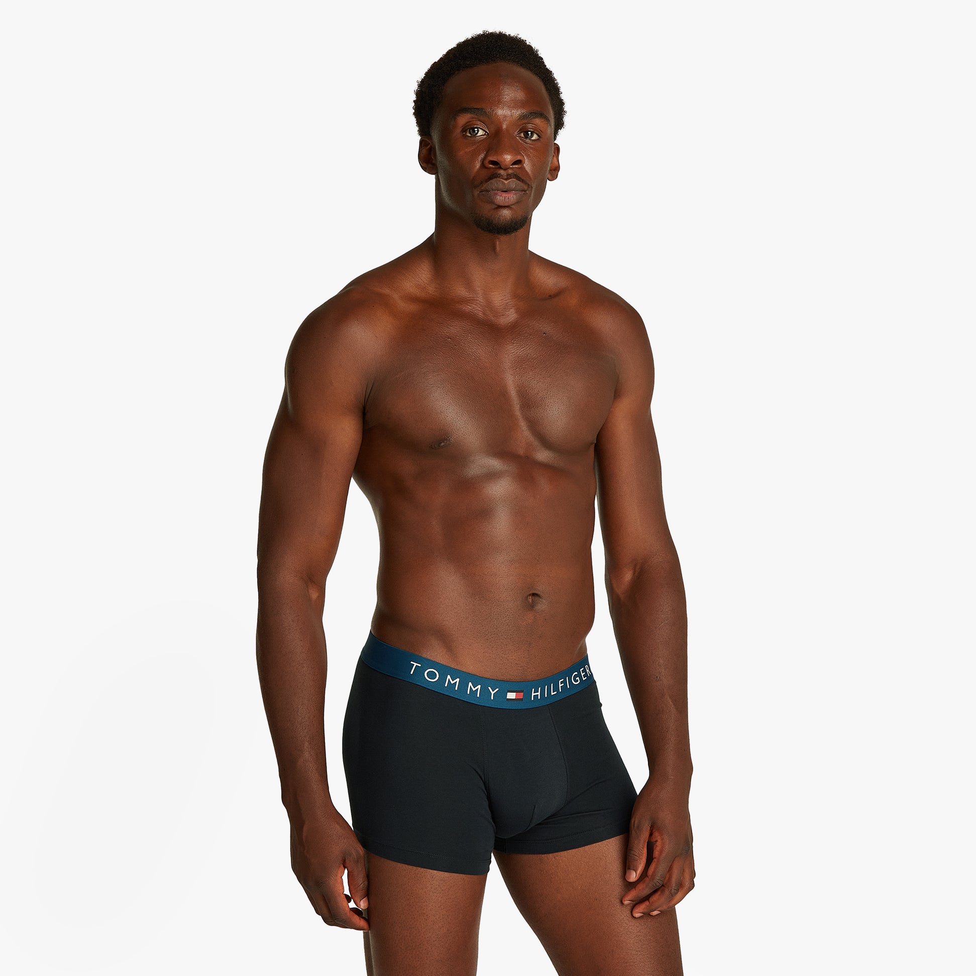Tommy Hilfiger ORIGINAL WAISTBAND 3 Pack Mens Trunks Navy front view on model showing elasticated waistband.