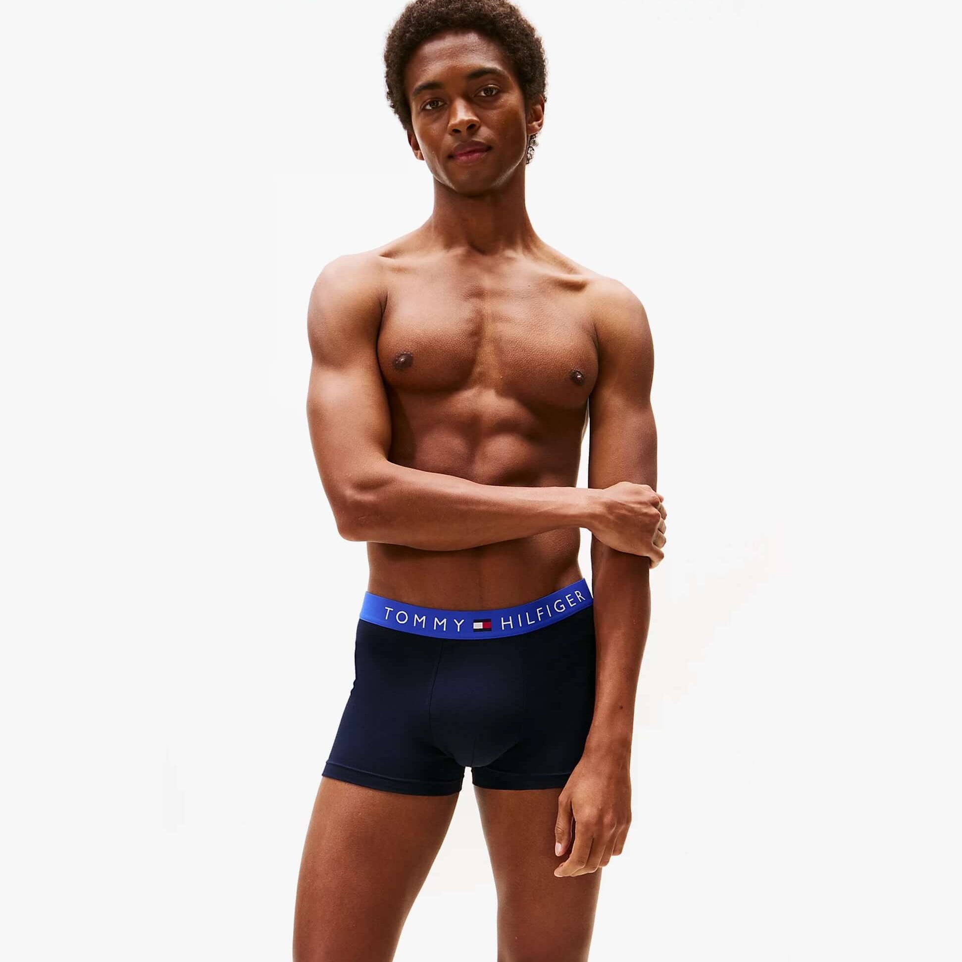 Tommy Hilfiger Mens 3 Pack Logo Waistband Trunks Navy side view on model showcasing waistband design.