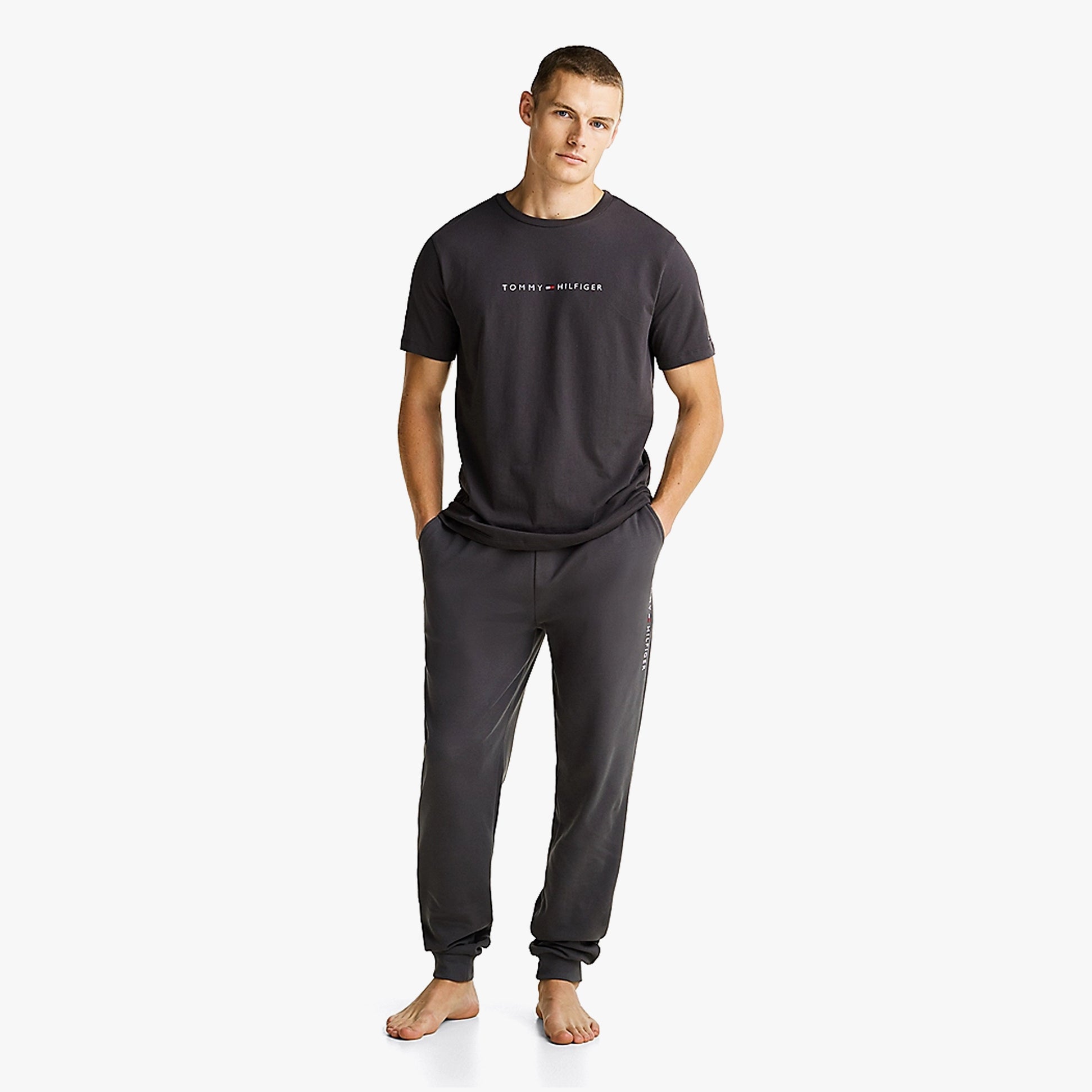 Tommy Hilfiger ORIGINAL LOGO Mens T Shirt Dark Ash front view worn with matching pants, showcasing comfort and lightweight cotton.