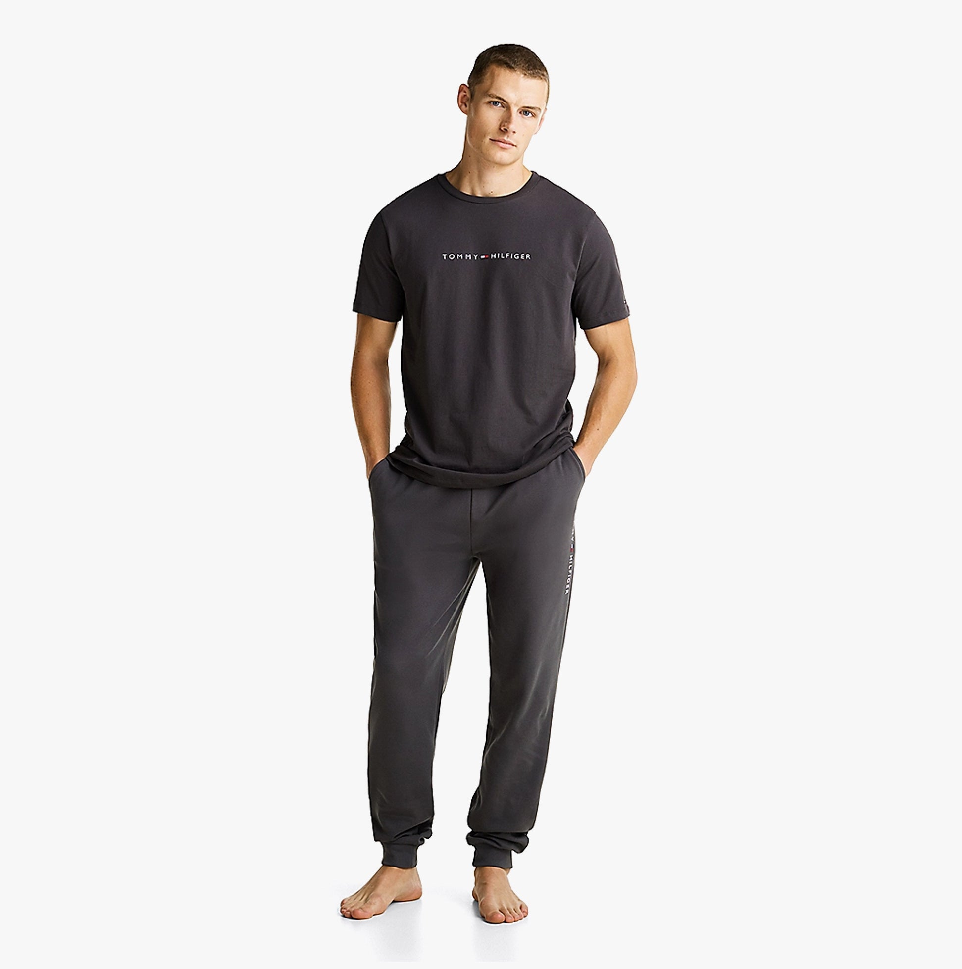 Tommy Hilfiger ORIGINAL LOGO Mens T Shirt Dark Ash front view worn with matching pants, showcasing comfort and lightweight cotton.