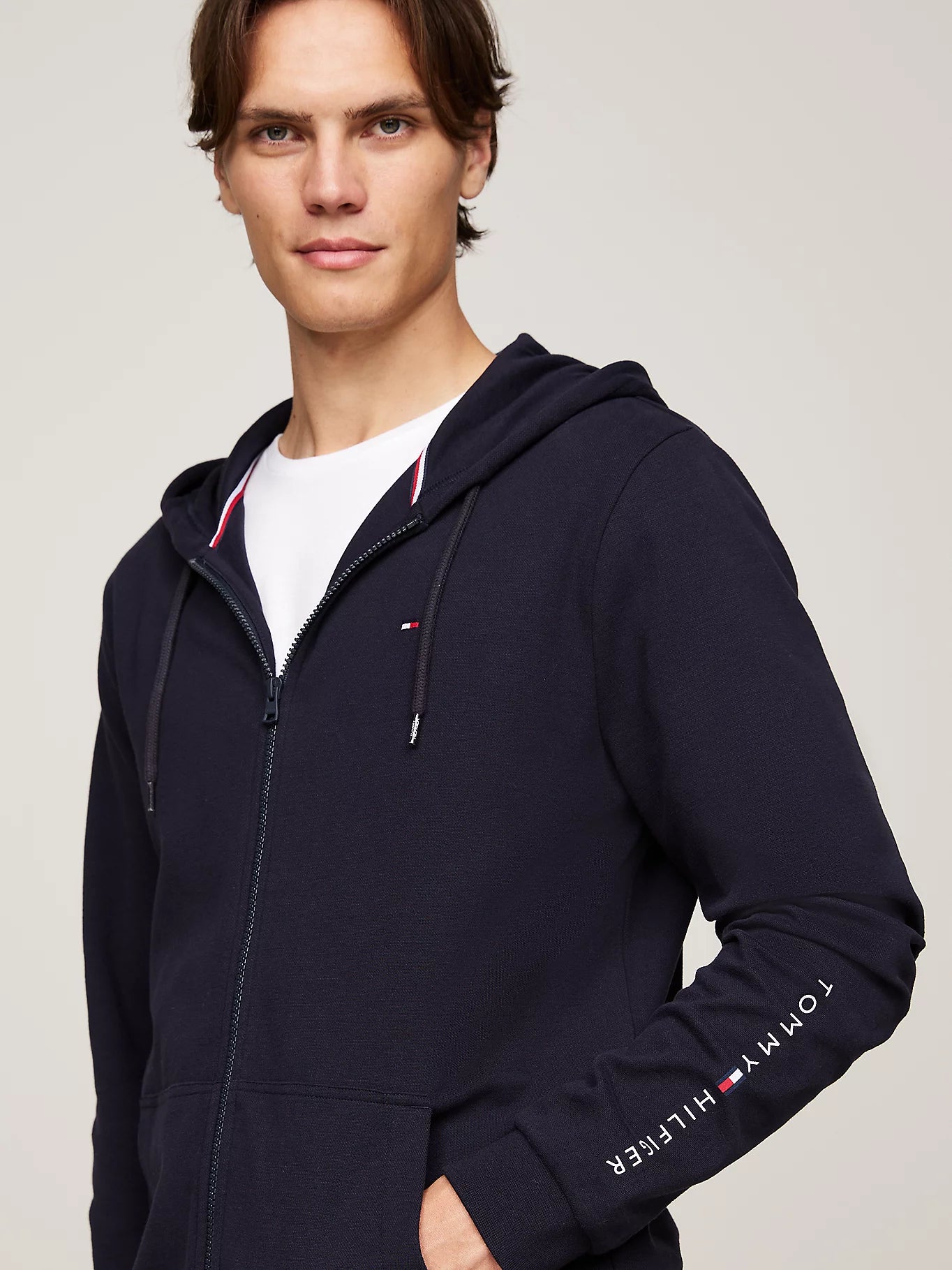 Tommy Hilfiger ORIGINAL LOGO Mens Full Zip Hoodie Desert Sky front view showcasing the drawstring hood and embroidered logo.