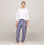 Tommy Hilfiger MONOTYPE Mens Pyjama Set White/Monotype Stripes Indigo front view with model wearing long-sleeve and striped pants.