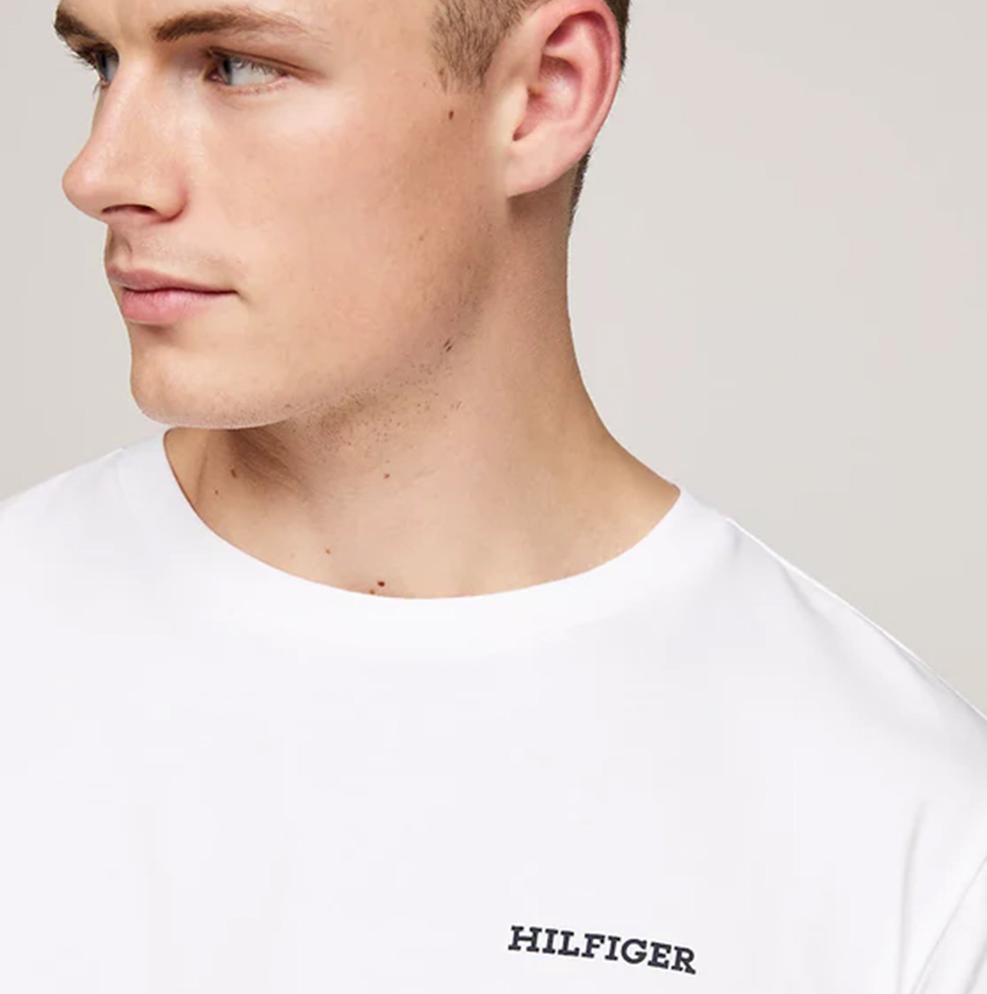 Tommy Hilfiger MONOTYPE Mens Pyjama Set White/Monotype Stripes Indigo, side view, model wearing a crew neck t-shirt.