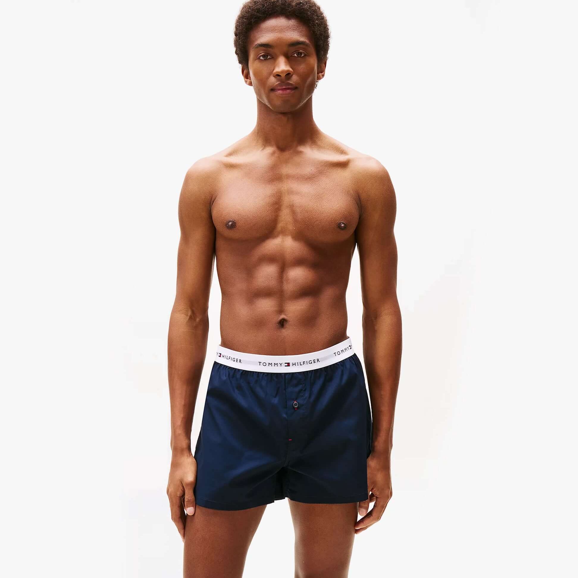 Tommy Hilfiger Mens 2 Pack Signature Logo Woven Boxer Shorts Navy front view model wearing shorts
