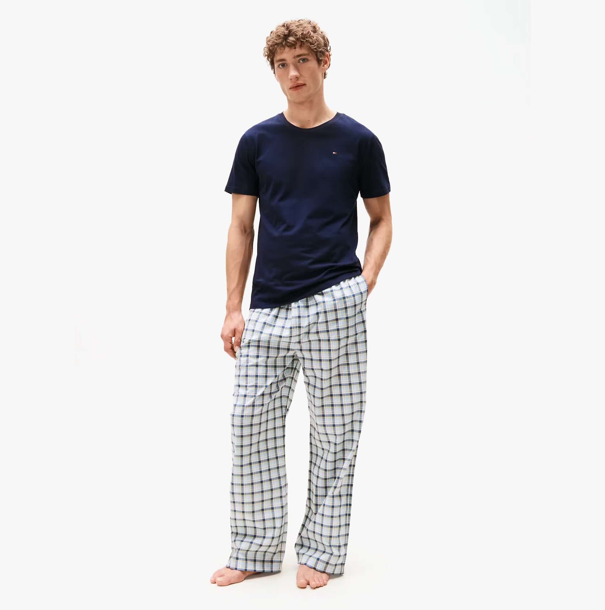 Tommy Hilfiger 3P SS TEE Mens T-Shirts & Tank Tops Multicoloured front view with model wearing navy t-shirt and plaid pants.