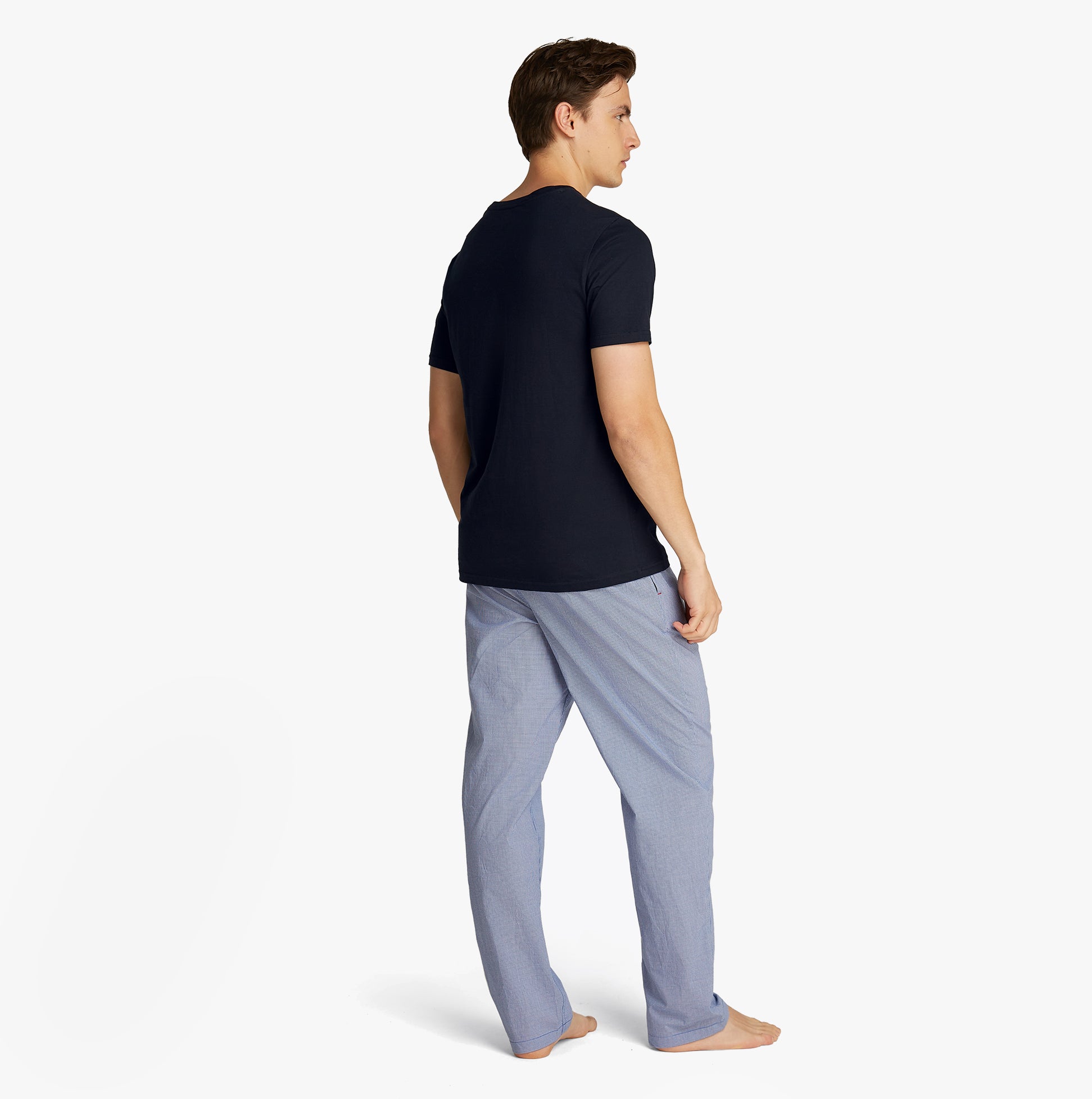 Tommy Hilfiger PURE COTTON 3 Pack Mens T-Shirts Desert Sky back view model wearing navy t-shirt and light pants.